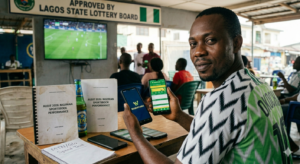 Man checking sports betting on phone